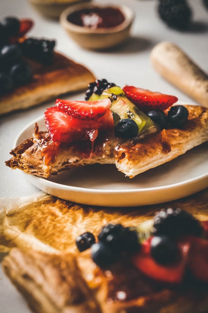 fruit pizza with a bite taken off