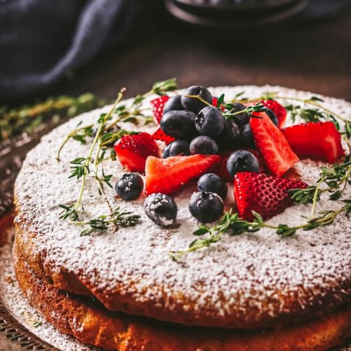 cake on a plate with berries