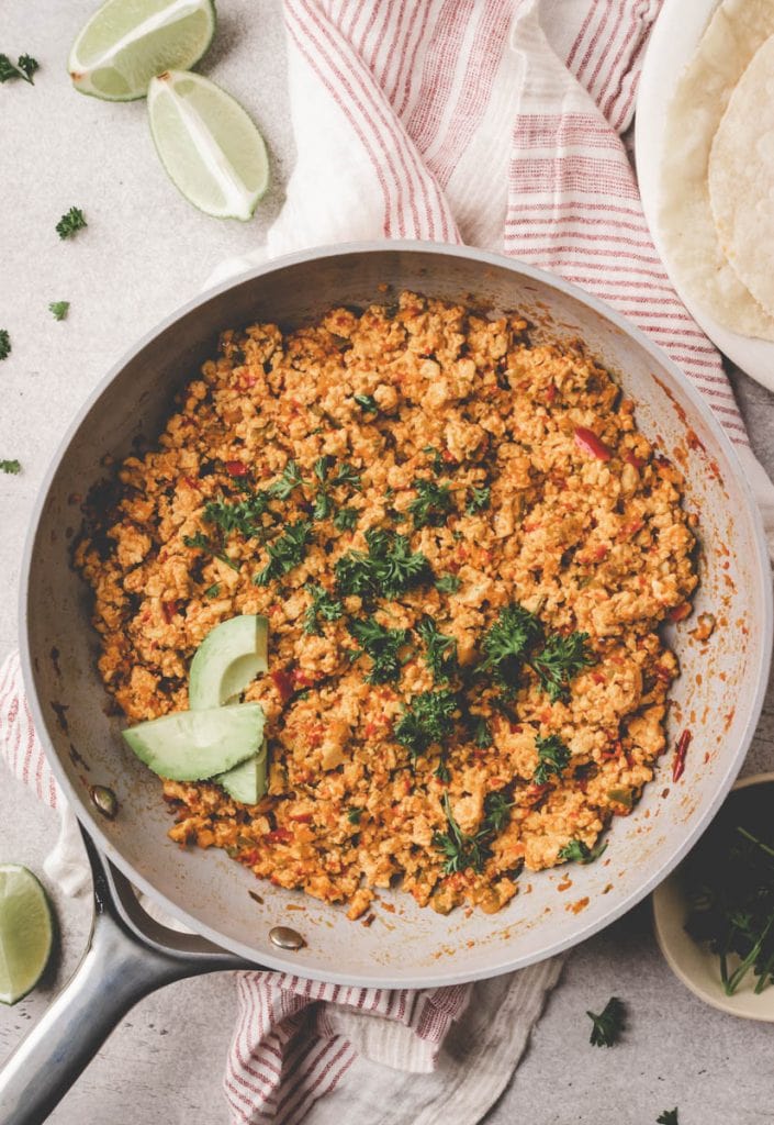 southwest tofu scramble in a pan with avocado on top