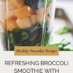 A close-up of a blender filled with fresh broccoli, mango chunks, and leafy greens. Text on the image reads: Healthy Smoothie Recipes. Refreshing broccoli smoothie with mango. whensaltyandsweetunite.com.