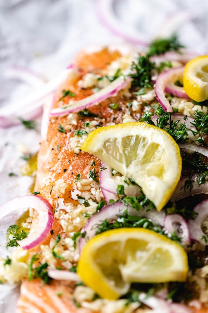 up close picture of baked salmon with lemon and dill