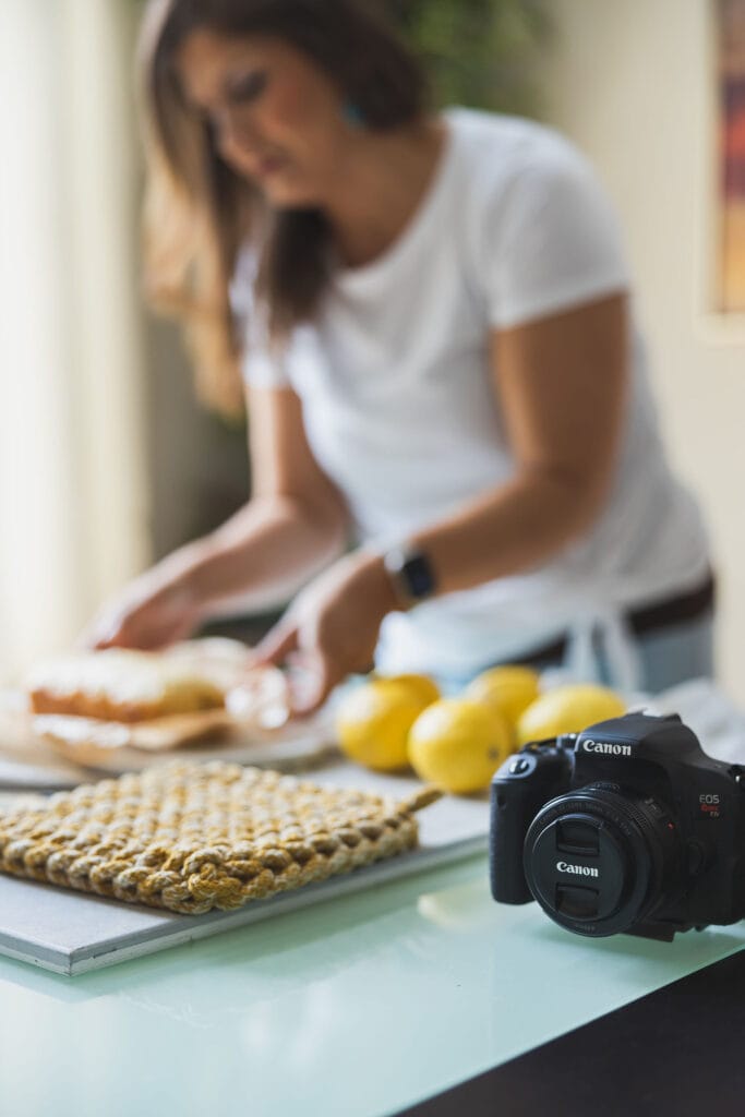 woman food styling and a camera