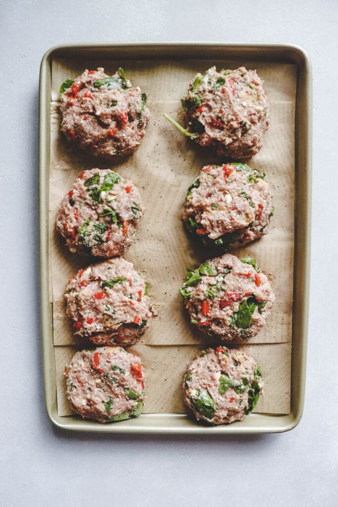 turkey basil burger patties on a tray