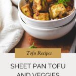 A bowl of roasted tofu cubes, sweet potatoes, and mixed vegetables, garnished with fresh herbs, sits on a wooden surface beside a white napkin. Text below reads “Sheet Pan Tofu and Veggies.”.