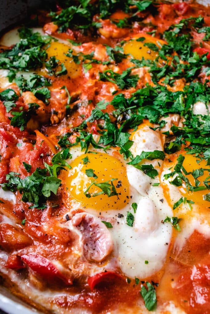close up of shrimp shakshuka with chunky tomato sauce