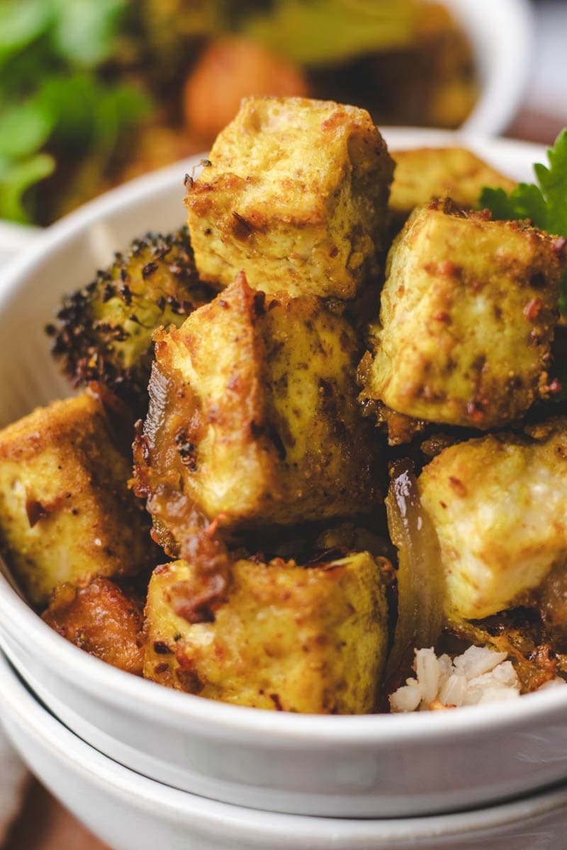 close up picture of roasted sheet pan tofu and sweet potato rice bowl