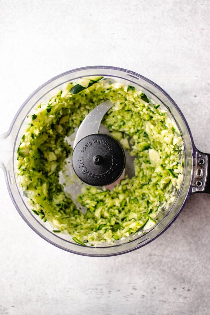 shredded zucchini in a food processor