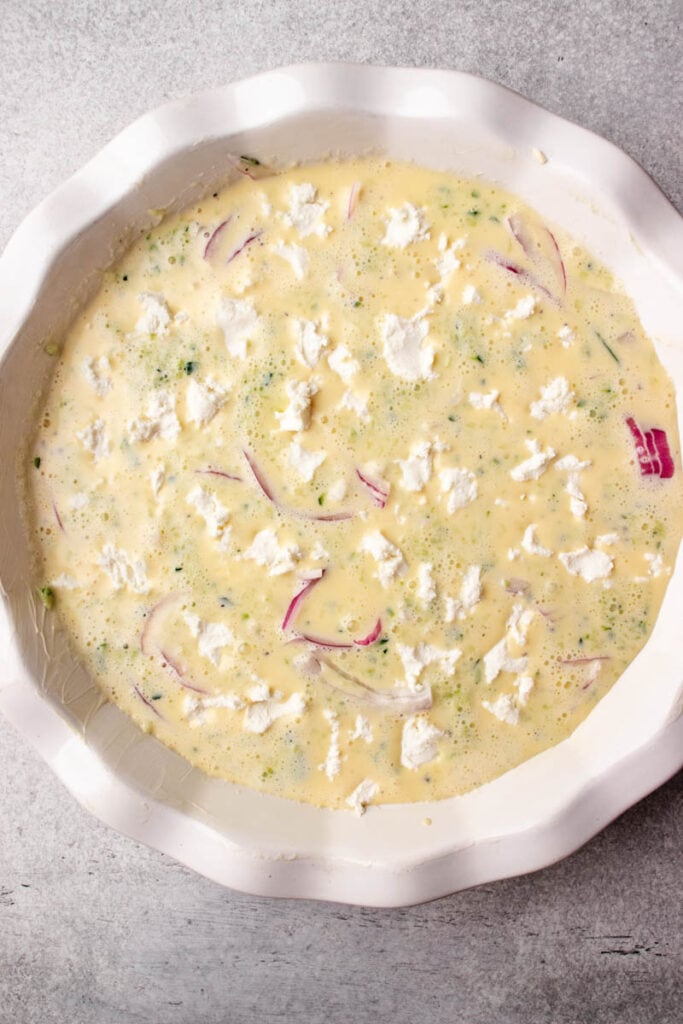 quiche egg mixture ready to go in the oven