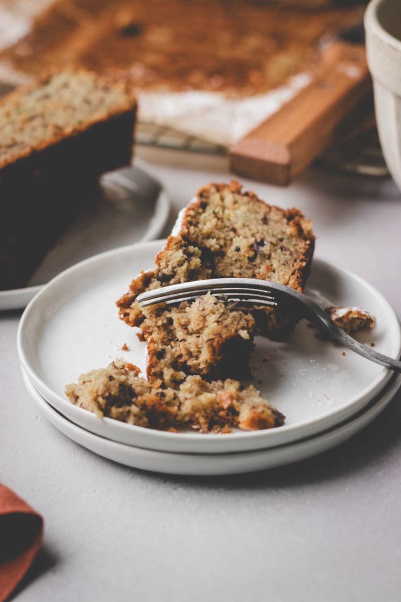best gluten free zucchini banana bread on a white plate