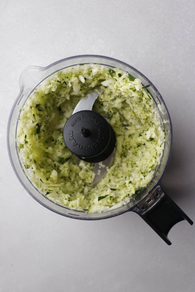 grated zucchini in a food processor
