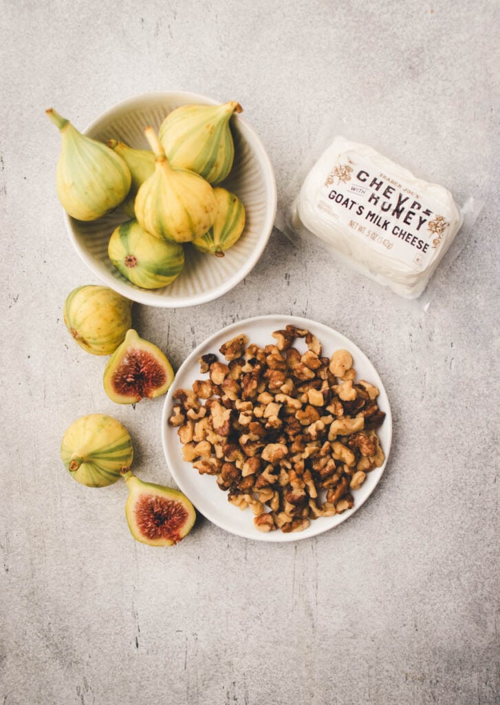 fresh figs, goat cheese, walnuts on a plate