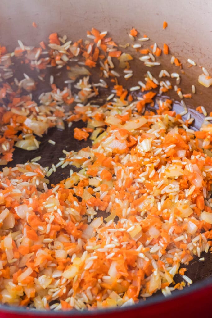 Process shot of Healthy Brown Rice and Quinoa Pilaf with Carrots.