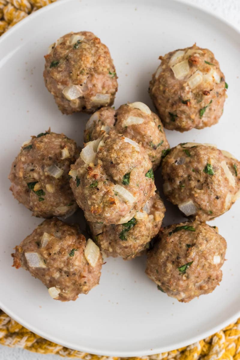Plate of meatballs on a white plate.