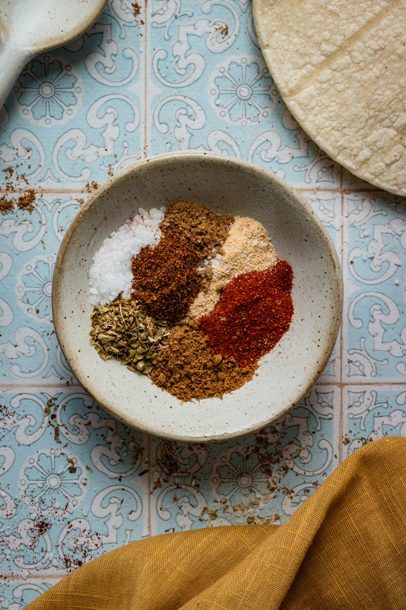 enchilada seasoning in a small white ramekin for enchilada spice.