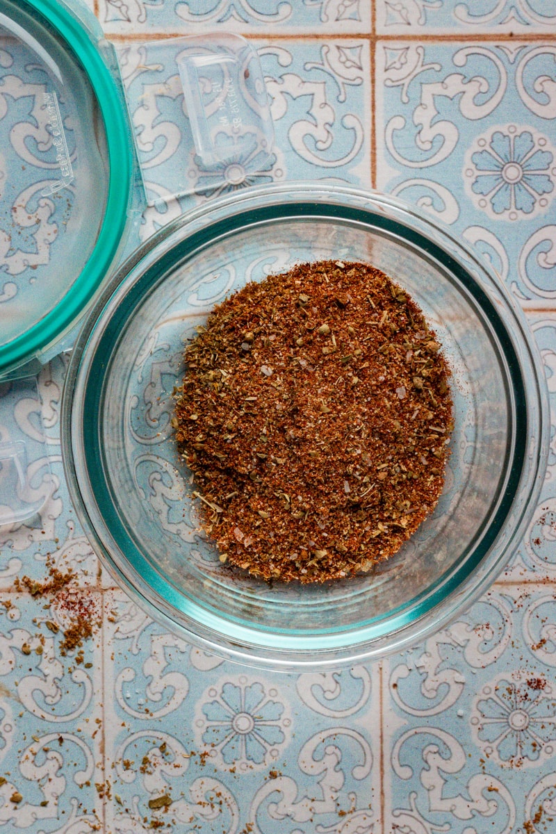 enchilada seasoning in a glass container for storing.