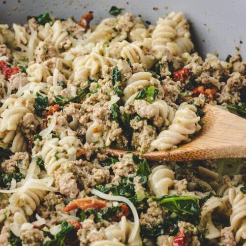 Close up pic of ground turkey pesto pasta .