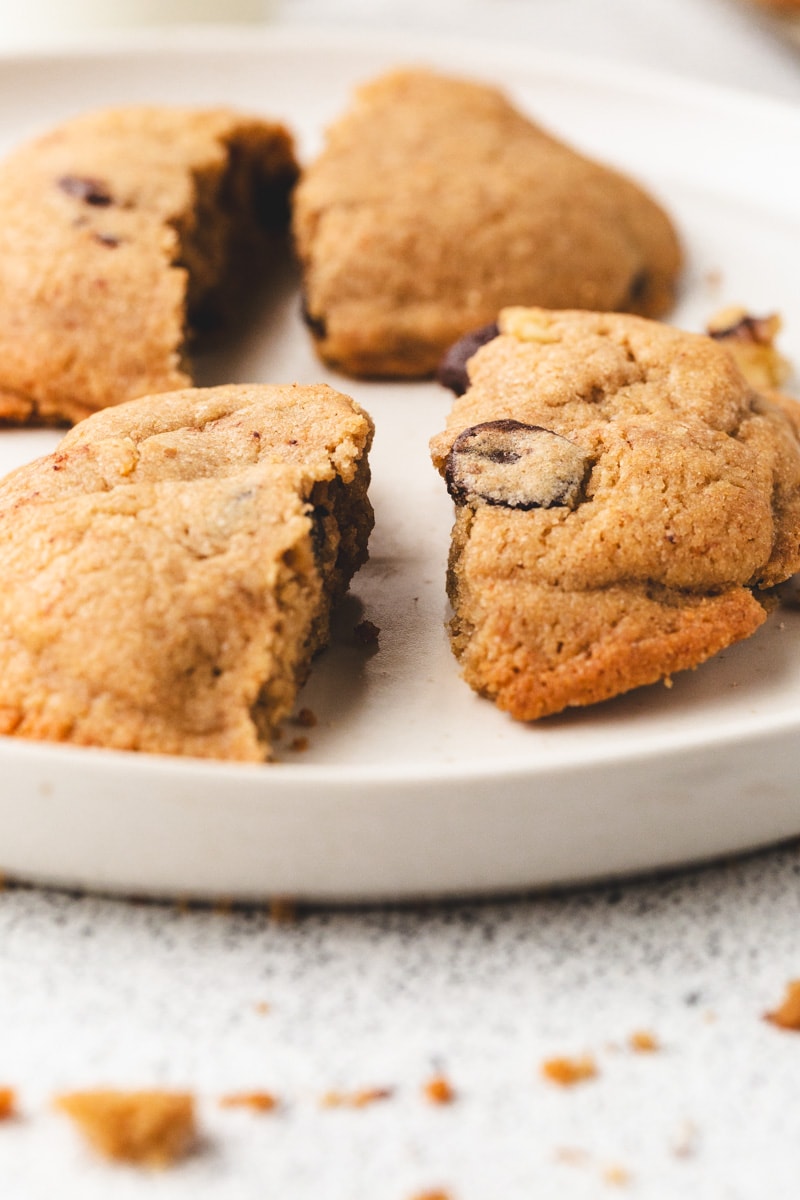 cookies on a white plate, broken in half.