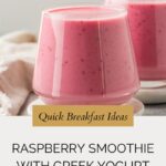 Two glasses filled with a creamy raspberry smoothie with Greek yogurt sit on a light surface. Overlay text reads Quick Breakfast Ideas: Raspberry Smoothie with Greek Yogurt, and a website URL appears at the bottom.