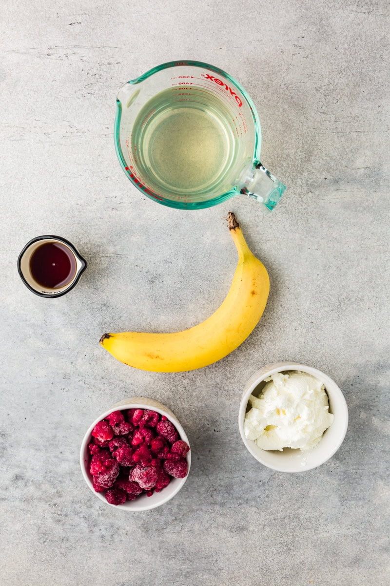 ingredients for a raspberry greek yogurt smoothie.