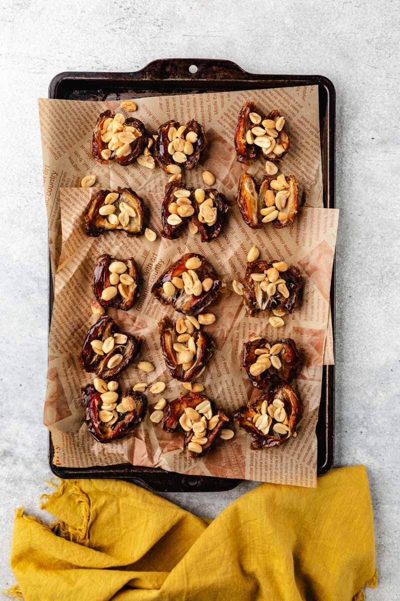 adding peanuts to the dates. 