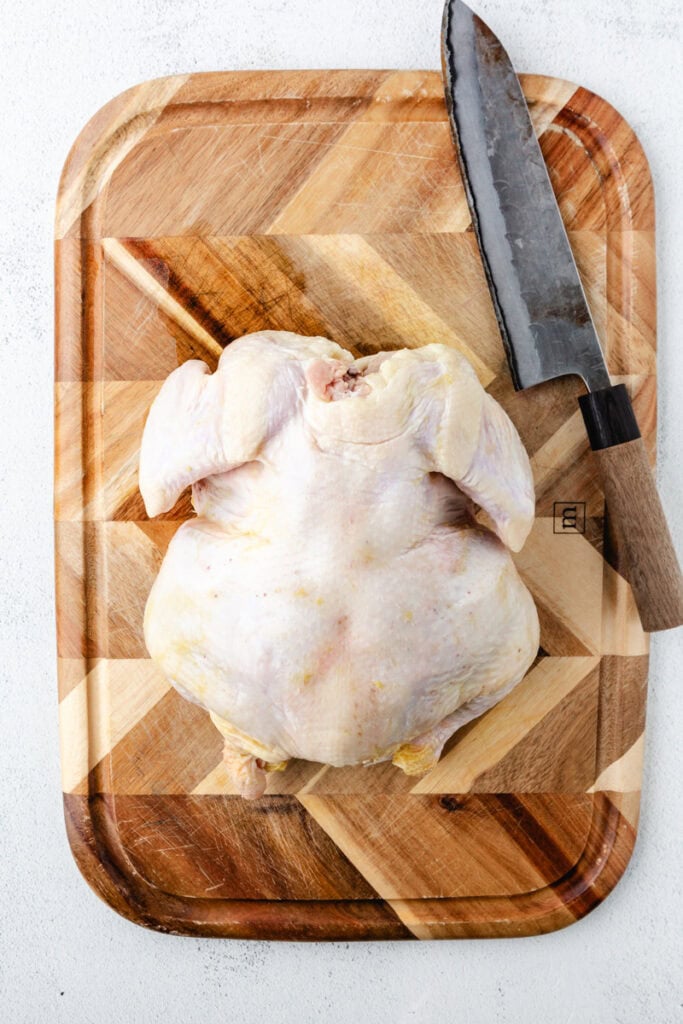 raw chicken on a cutting board. 