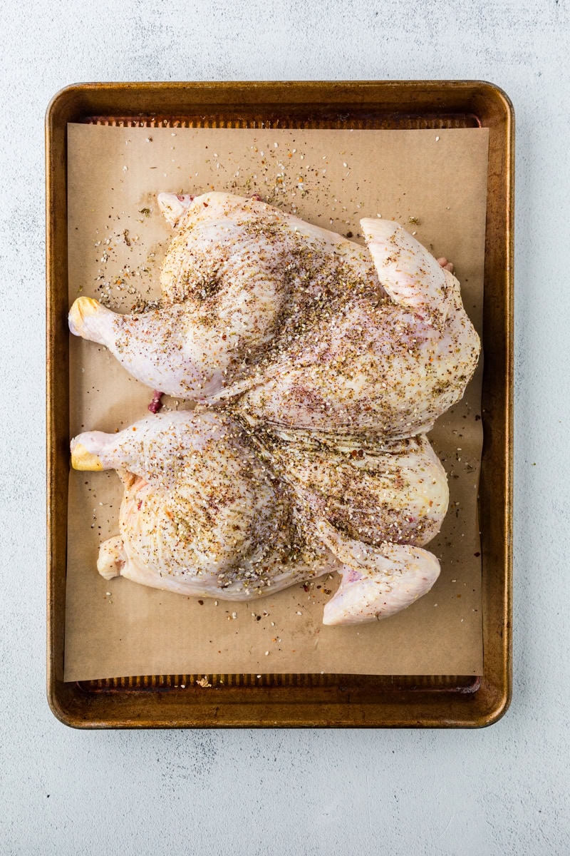 raw chicken seasoned with za'atar.