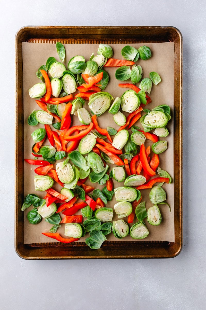 Prepping peppers and brussel sprouts.