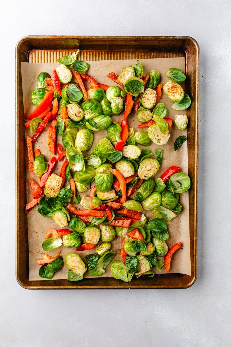 seasoning and adding oil to the vegetables.