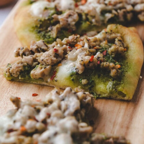close up of slice of chicken pesto flatbread