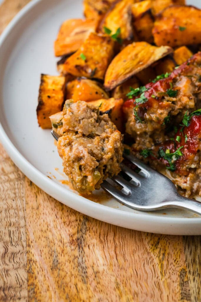close up of turkey meatloaf on a fork.