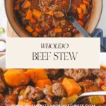 A warm pot of Whole30 Beef Stew brimming with tender chunks of beef, carrots, and vibrant vegetables, invitingly captured in a close-up shot. A spoon rests casually in the pot. Discover the recipe at www.whensaltyandsweetunite.com.