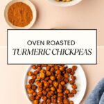 A plate of turmeric roasted chickpeas sits beside a small bowl of raw chickpeas and a dish of vibrant turmeric powder. The text Turmeric Roasted Chickpeas graces the image, with the website URL at the bottom.