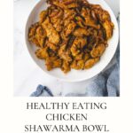 A bowl of chicken shawarma garnished with spices sits invitingly on the table. A text overlay reads, Healthy Eating: Chicken Shawarma Bowl alongside a vibrant salad and a dish of fragrant yellow rice tucked in the corner.