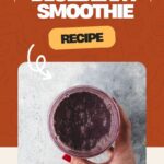 A hand holds a glass of creamy blueberry smoothie, enhanced with Greek yogurt, against a textured background. The image features text saying Healthy Blueberry Smoothie Recipe and the website whensaltyandsweetunite.com at the bottom.