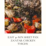 A wooden spoon lifts zaatar-seasoned chicken thigh over a sheet pan with roasted potatoes, red bell peppers, and herbs. Text below reads, EASY 30 MIN ZA’ATAR CHICKEN SHEET PAN DINNER.