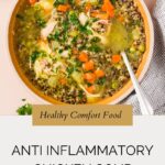 A bowl of chicken soup with vegetables and herbs, labeled Healthy Comfort Food and Anti Inflammatory Chicken Soup with the website whensaltyandsweetunite.com at the bottom. A spoon rests inside the bowl.