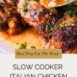 Close-up of seasoned slow cooker Italian chicken topped with onions and herbs, served with a spoonful of sauce. Text overlay reads: Meal Prep For The Week: Slow Cooker Italian Chicken. Website: whensaltyandsweetunite.com.