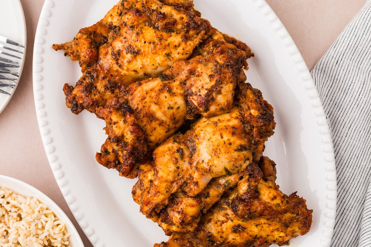 A plate of chicken on a table.