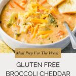 A bowl of creamy gluten free broccoli cheddar soup topped with shredded cheese, served with toasted bread slices. The text on the image reads “Meal Prep For The Week: Gluten Free Broccoli Cheddar Soup.”.