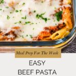 A glass baking dish filled with Beef Pasta Casserole, topped with melted cheese and fresh herbs. Text overlay reads: Meal Prep For The Week. Easy Beef Pasta Casserole. whensaltyandsweetunite.com.