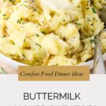 A bowl of creamy mashed potatoes with buttermilk, garnished with chopped herbs, with a spoon resting inside. Text reads: Comfort Food Dinner Ideas – Buttermilk Mashed Potatoes.