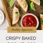 Overhead view of crispy baked bison tacos with lime wedges, salsa in a red dish, and a bowl of sour cream on parchment paper. Text reads: “Healthy Appetizers: Crispy Baked Bison Tacos.”.