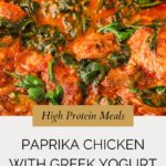 Close-up of paprika chicken with wilted spinach in a creamy red sauce, labeled as a high protein meal with Greek yogurt; text below reads Paprika Chicken made with Greek Yogurt and recipe website link.