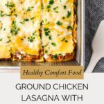 A baking dish of Ground Chicken Lasagna with zucchini, topped with melted cheese and parsley. Text below reads: “Healthy Comfort Food: Ground Chicken Lasagna with Zucchini.” A serving spatula is nearby.
