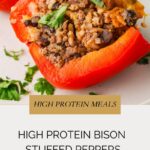 A close-up of bison stuffed peppers filled with black beans, rice, and herbs on a white plate. Text reads: High Protein Bison Stuffed Peppers and High Protein Meals.